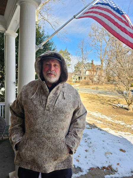 This WeatherWool Anorak had been sitting out in the weather, rain, sleet, snow and freezing temperatures, for 26 days. The weather-treatment removed a strong smell of cologne.