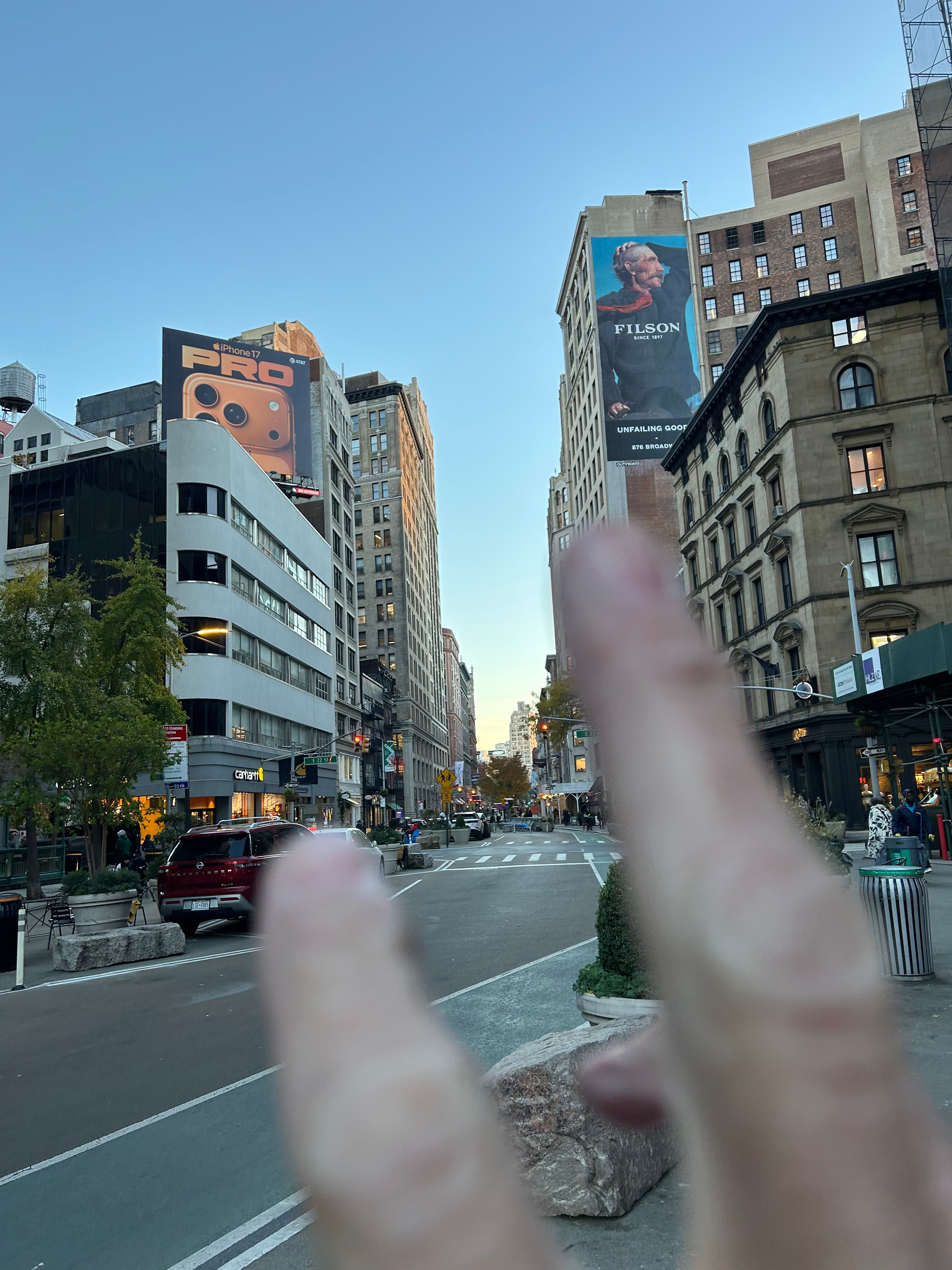 WeatherWool is very interested to see, in November of 2025, a Filson billboard across the street from a Carhartt retail store on Broadway at 22nd Street in Midtown Manhattan, New York City.  Photo credits THANKS JR MORRISSEY/Factory8